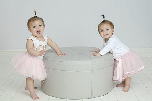 Twin baby girls with pink tutus